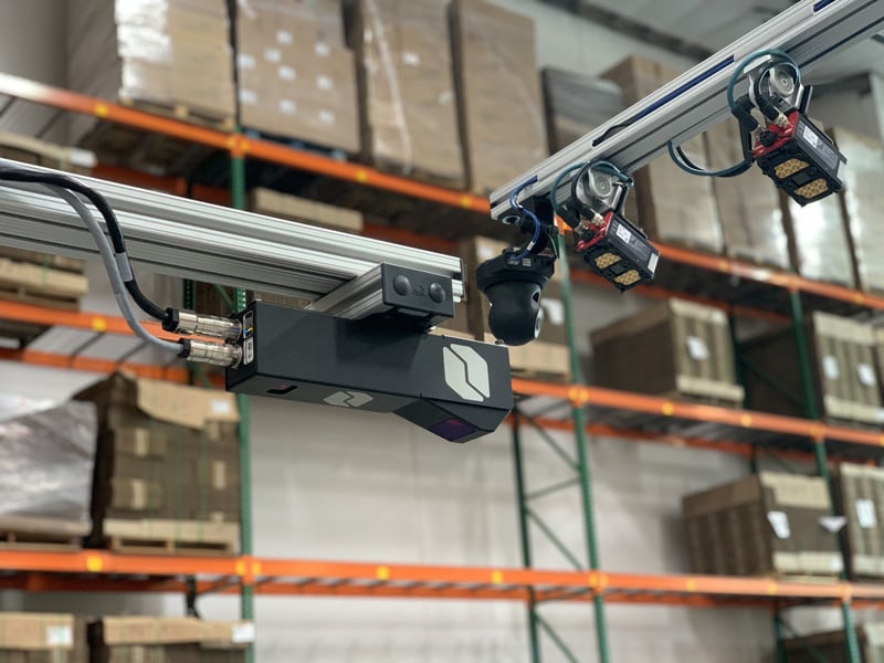 Cubiscan 210-L overhead dimensioning sensor that measures boxes in high-speed and high-volume shipping operations. It's placed over conveyor to dimension parcels as they pass underneath the sensor