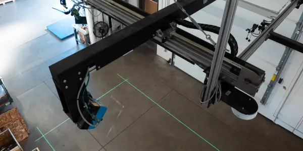 Install & Warranty Images for 1200 man scanning a broom head for the purpose of slotting or warehouse pick and pack using dimensioning systems